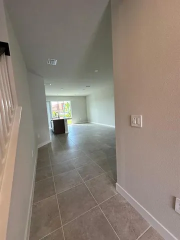 a view of empty room with windows