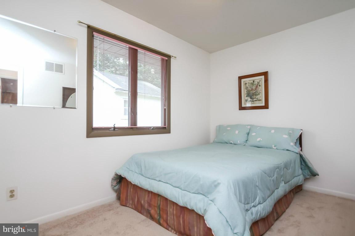 1701 Wilson Point Road Baltimore, MD 21220 - Photo 15 of 27 a bedroom with a bed and a window