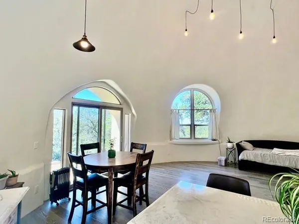 a view of a dining room with furniture and window