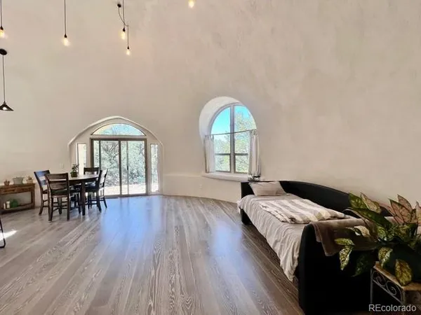 a bedroom with a bed and a table