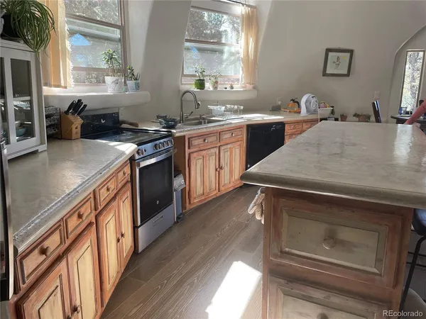 a kitchen with a stove and a sink