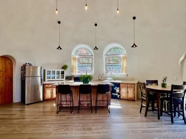 a view of a dining room with furniture window and wooden floor