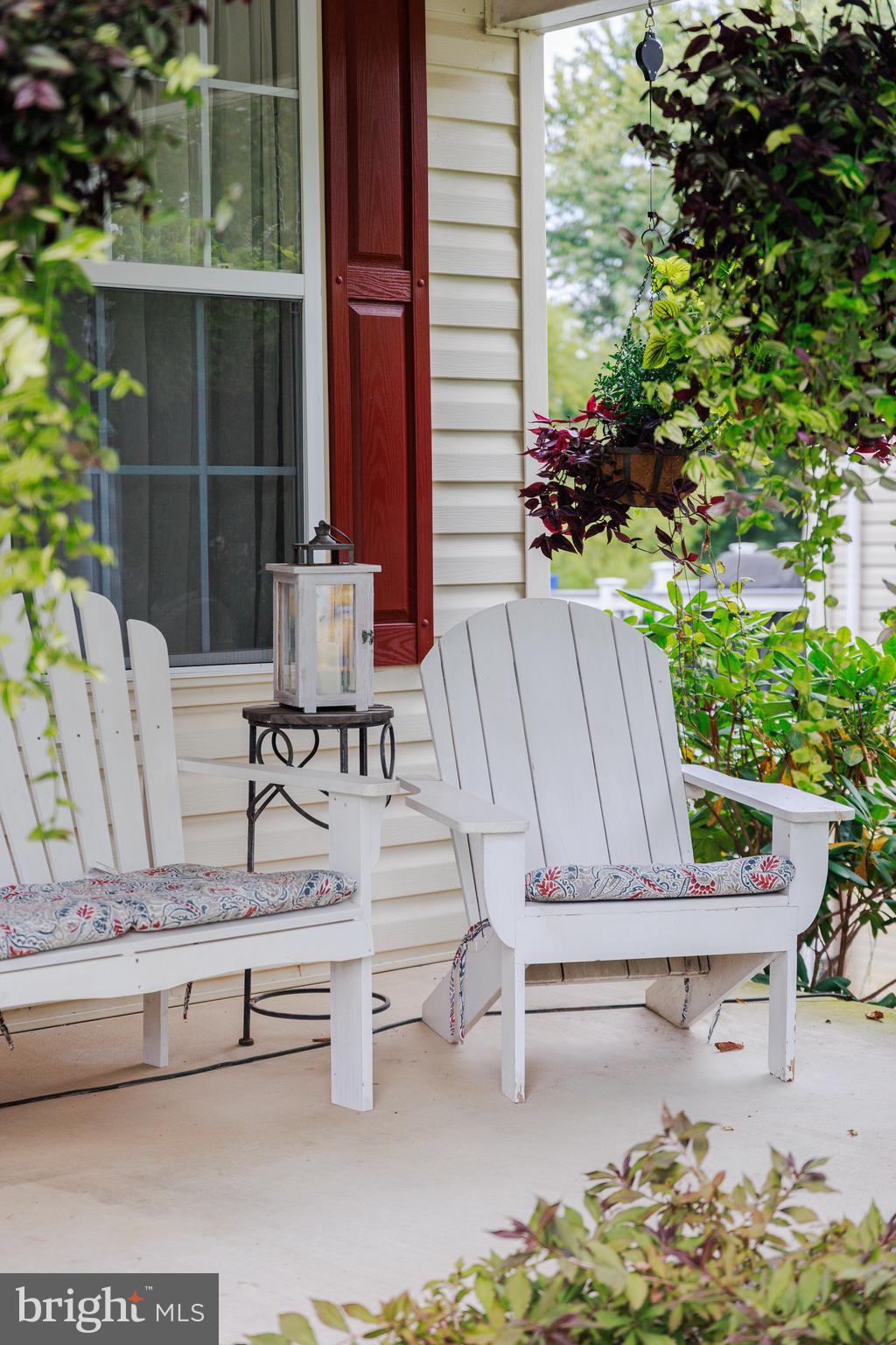 6265 White Birch Road Eldersburg, MD 21784 - Photo 3 of 17 a view of balcony with two chairs and a potted plant