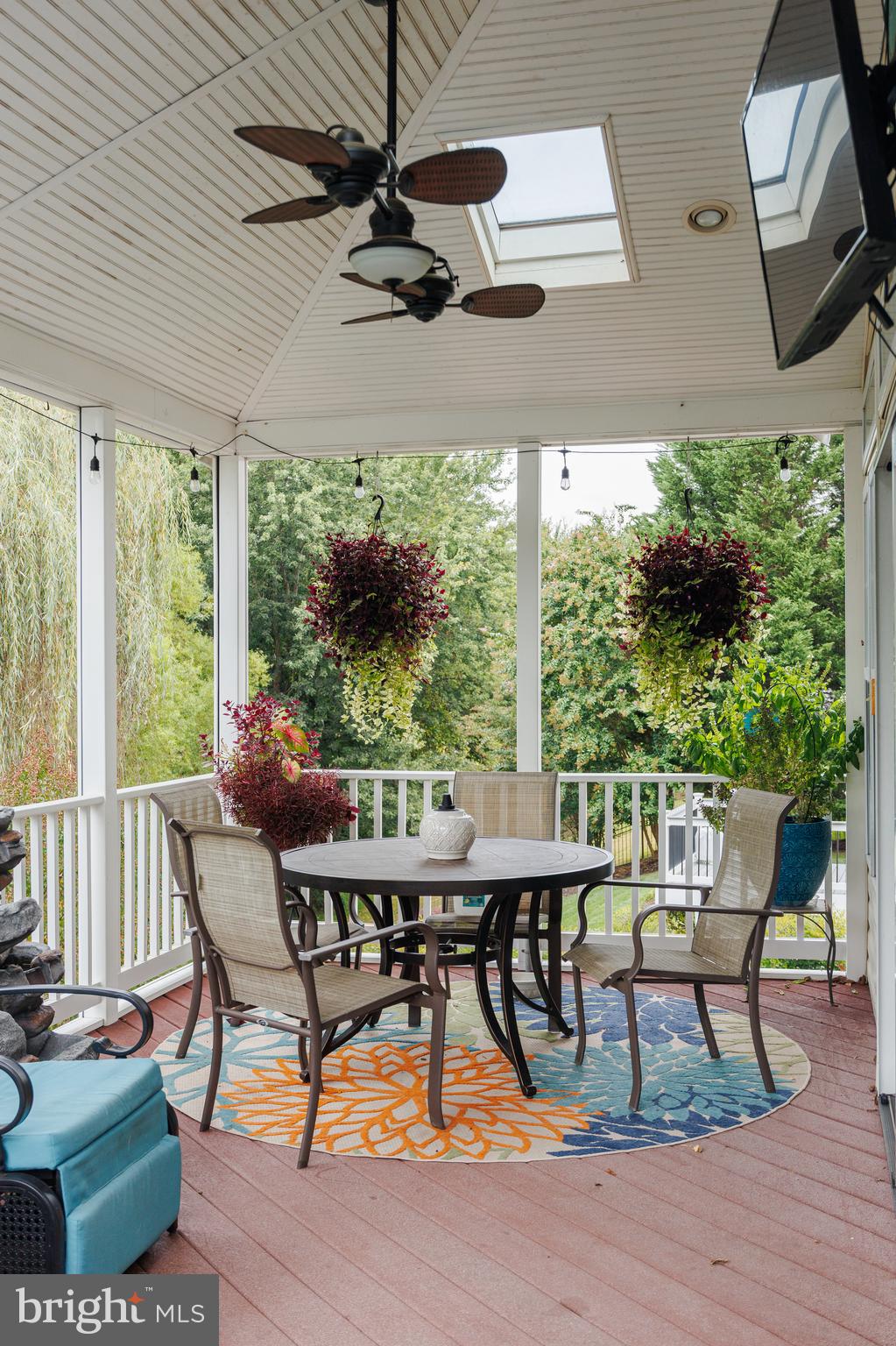 6265 White Birch Road Eldersburg, MD 21784 - Photo 7 of 17 a view of a patio with table and chairs and potted plants