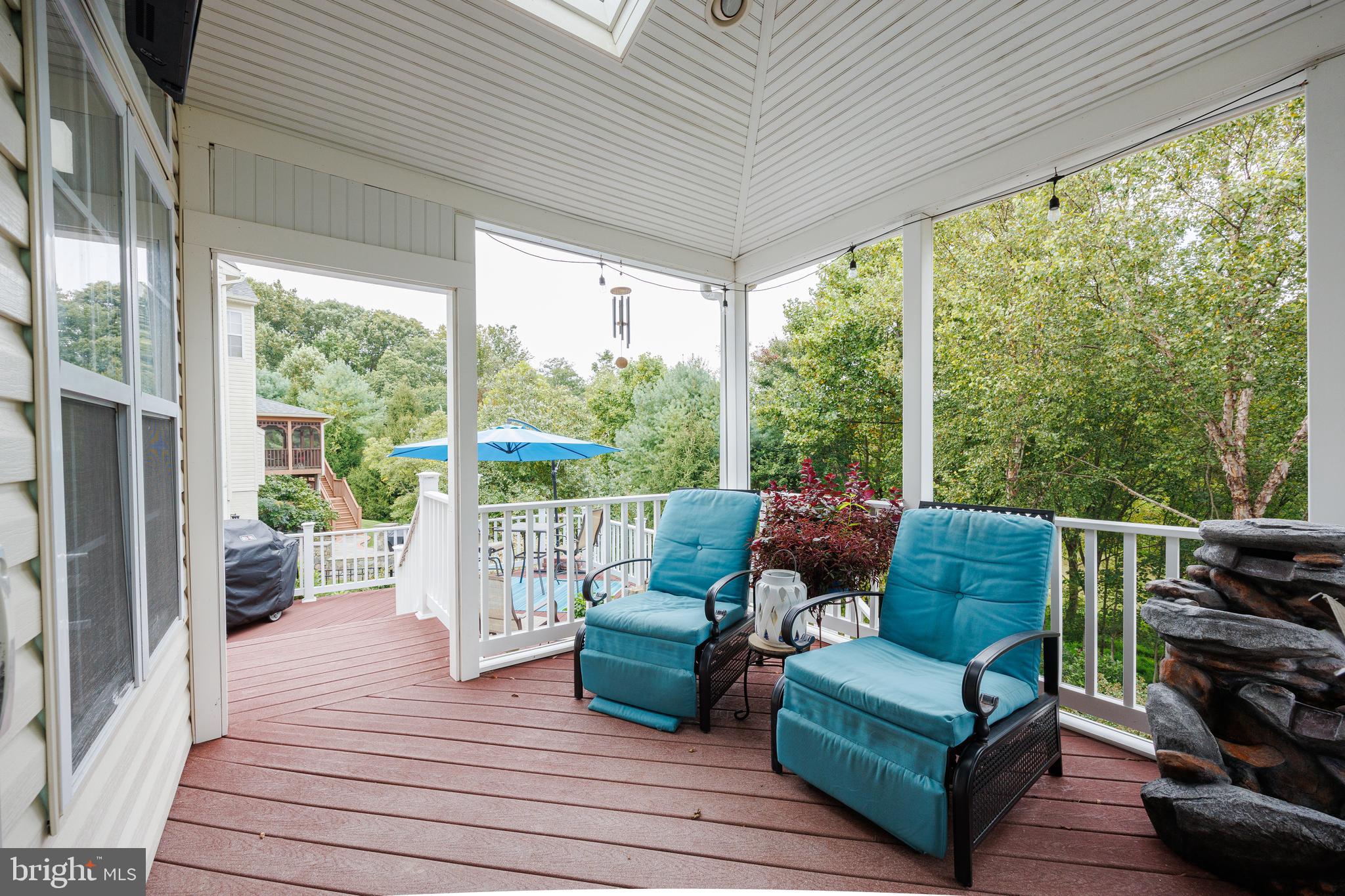 6265 White Birch Road Eldersburg, MD 21784 - Photo 9 of 17 a balcony with wooden floor and outdoor seating