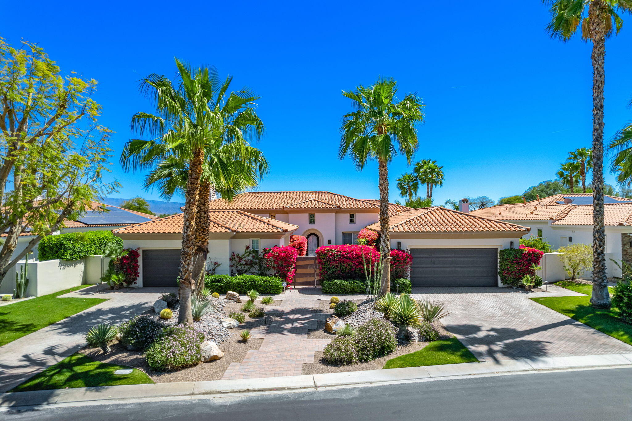334 Loch Lomond Road Rancho Mirage, CA 92270 - Photo 1 of 1 a front view of a house with garden