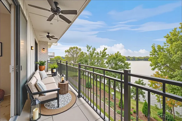 a view of a chairs and table in a balcony