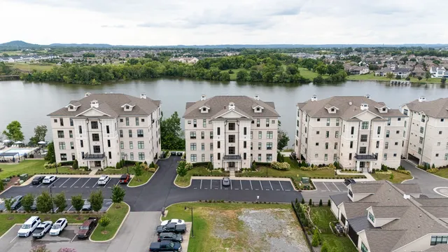 an aerial view of a house with a lake view