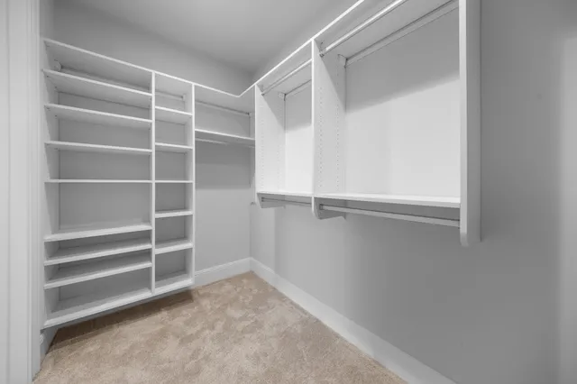 a view of an empty walk in closet