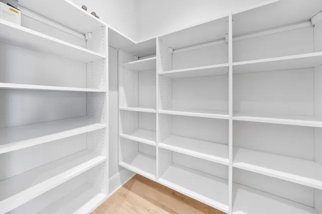 a view of a building with a garden and plants