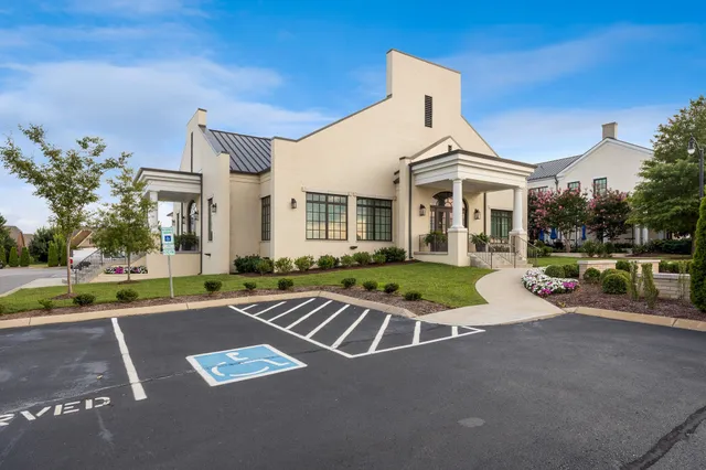 a view of a house with brick walls