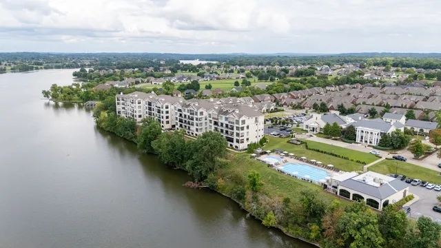 an aerial view of a house with a lake view