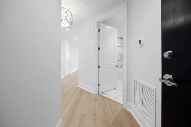 a living room with furniture a table and a large window