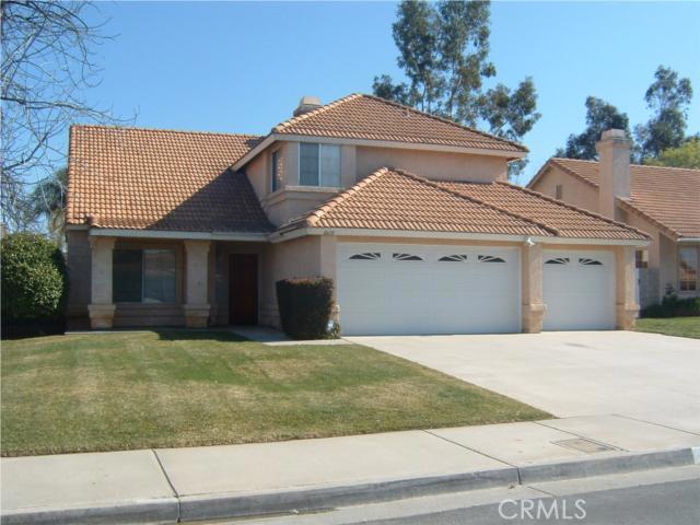 8610 Barton Street Riverside, CA 92508 - Photo 1 of 1 a front view of a house with a yard and garage
