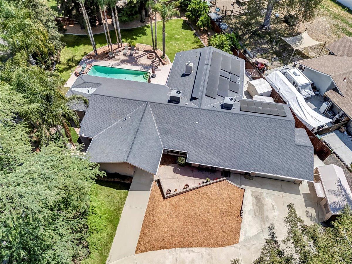 30960 Tower Road Visalia, CA 93292 - Photo 12 of 76 an aerial view of a house with a yard and trees