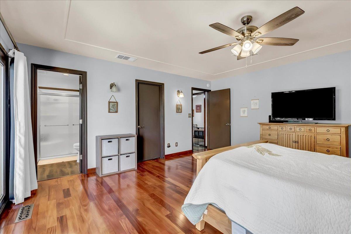 30960 Tower Road Visalia, CA 93292 - Photo 19 of 76 a bedroom with a bed and a flat screen tv