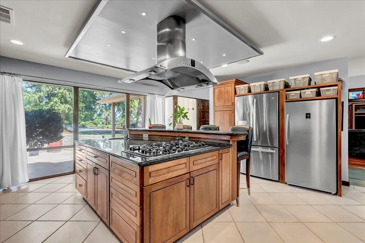 30960 Tower Road Visalia, CA 93292 - Photo 2 of 76 a kitchen with stainless steel appliances granite countertop a stove a refrigerator and a sink
