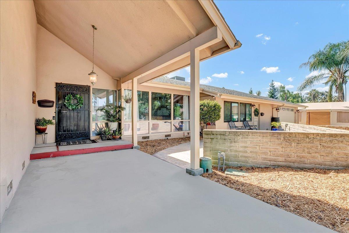 30960 Tower Road Visalia, CA 93292 - Photo 38 of 76 a view of a patio with table and chairs and potted plants