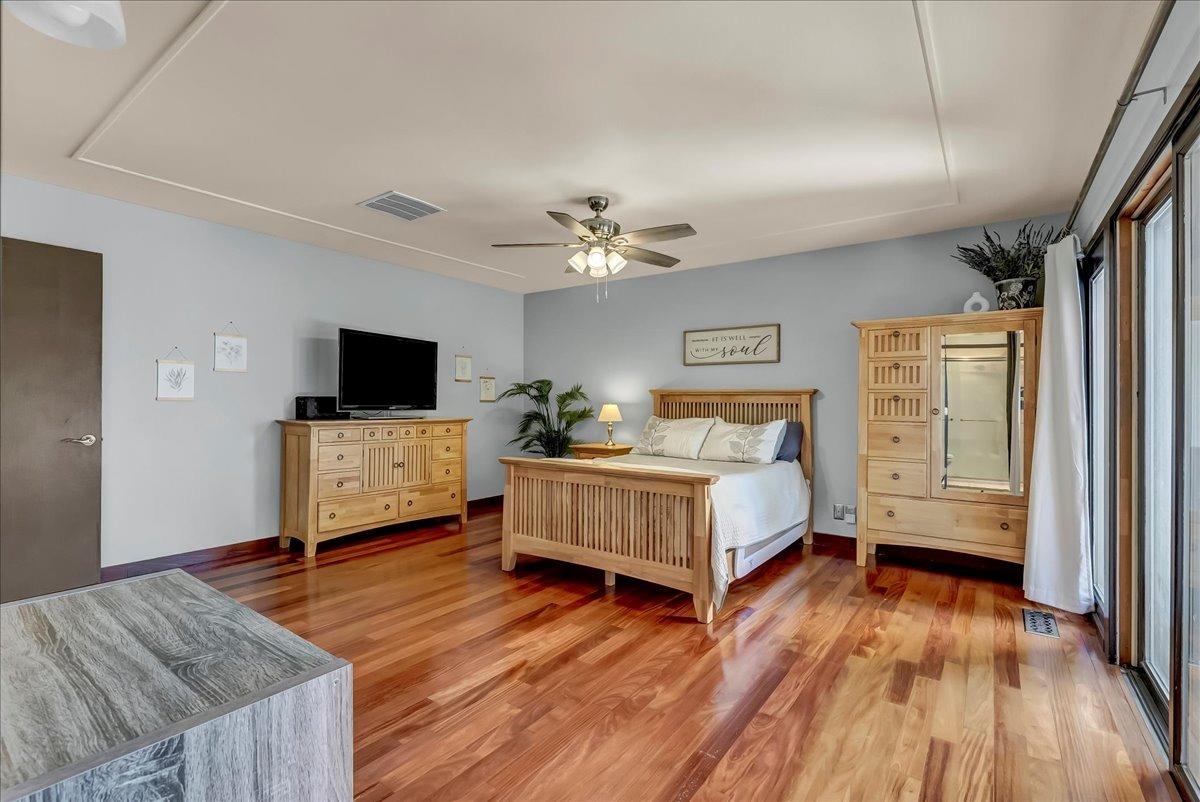 30960 Tower Road Visalia, CA 93292 - Photo 44 of 76 a spacious bedroom with a bed and a flat screen tv