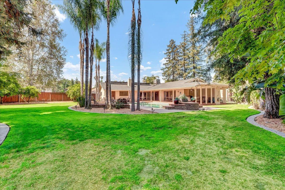 30960 Tower Road Visalia, CA 93292 - Photo 62 of 76 a view of a house with backyard and a sitting area
