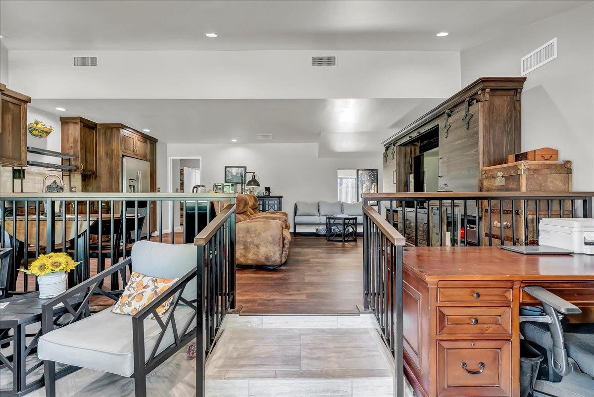 30960 Tower Road Visalia, CA 93292 - Photo 66 of 76 a living room with furniture a rug and a book shelf