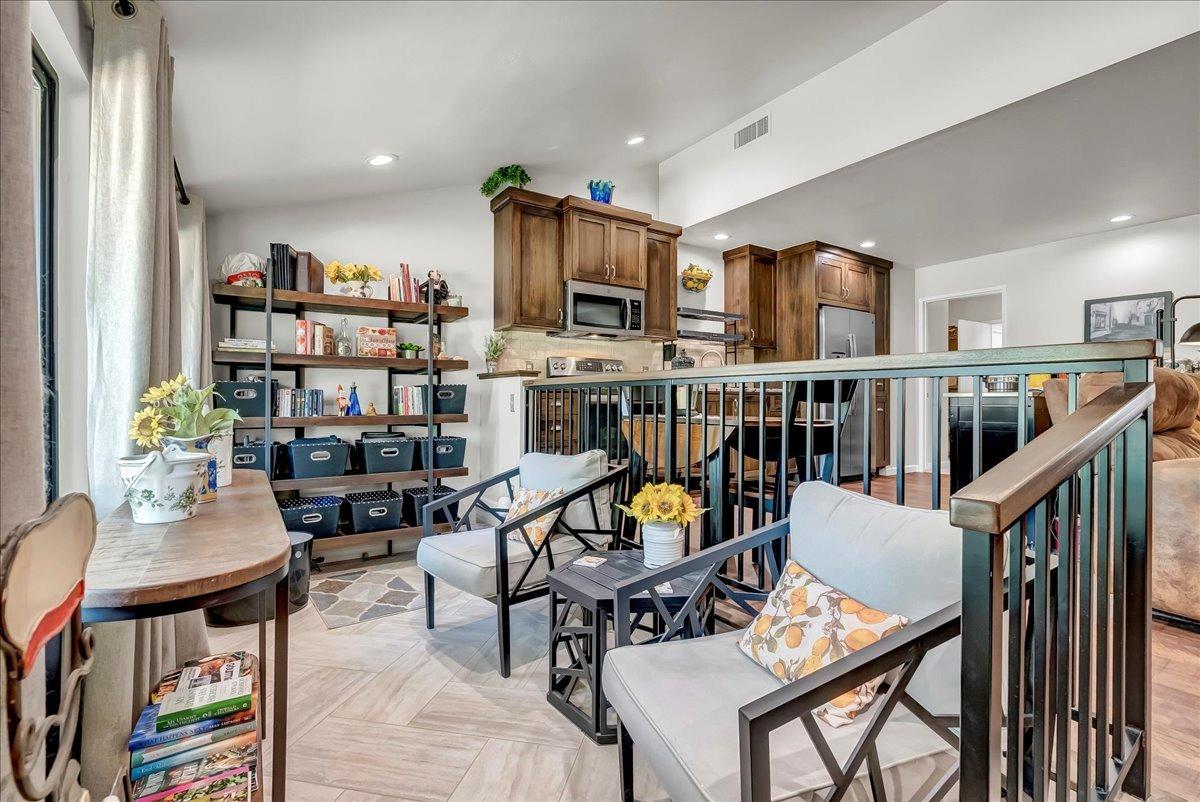 30960 Tower Road Visalia, CA 93292 - Photo 67 of 76 a living room with furniture a rug and a book shelf