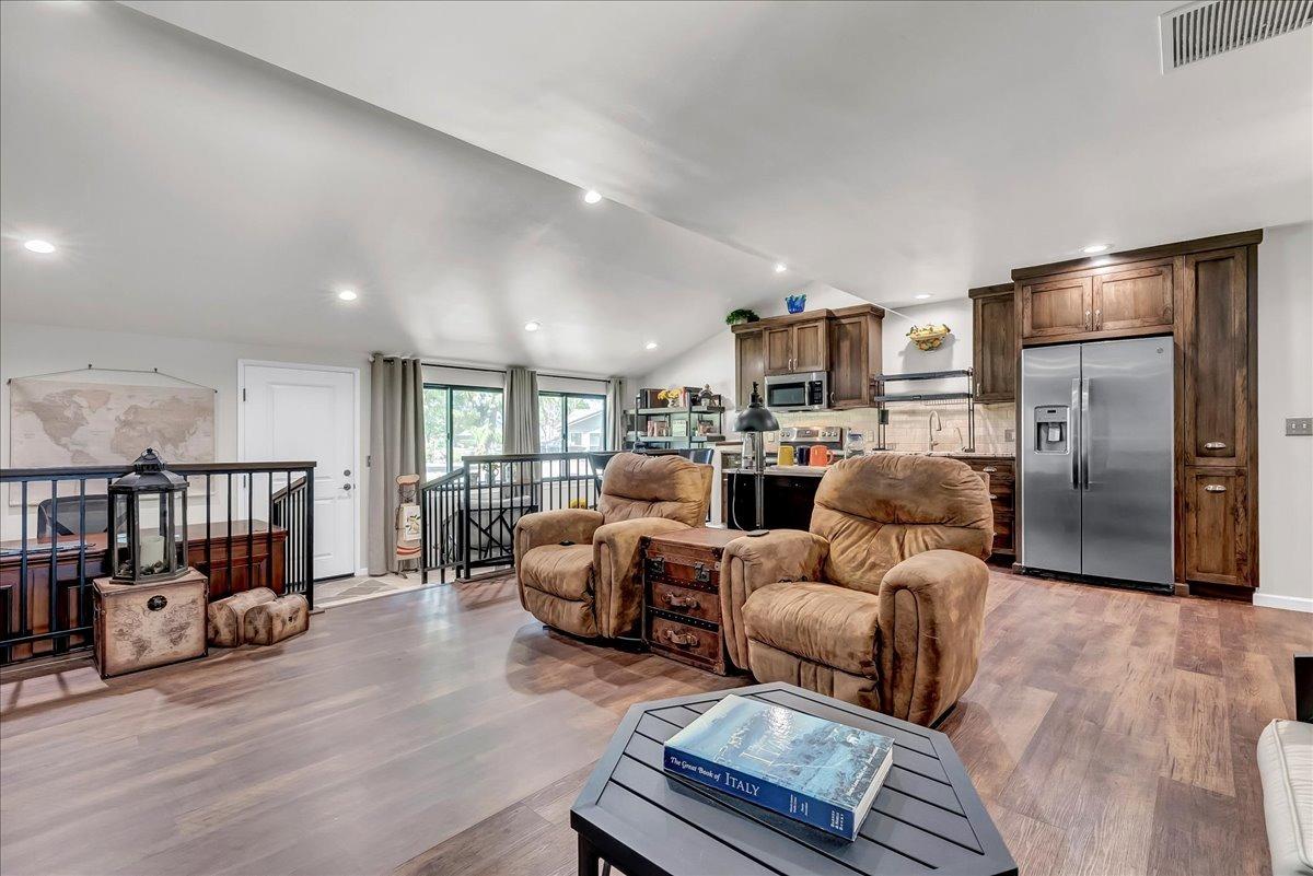 30960 Tower Road Visalia, CA 93292 - Photo 69 of 76 a bed room with furniture and a book shelf