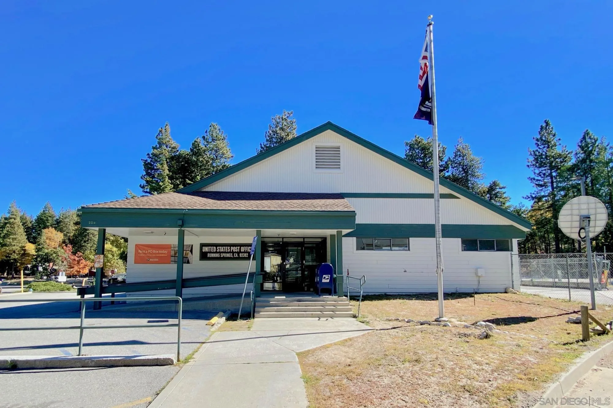32065 Hunsaker Way, Unit 12 Running Springs, CA 92382 - Photo 14 of 39 a front view of a house with a yard
