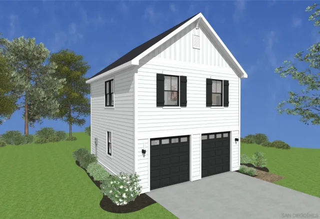 a white building with a yard and seating space