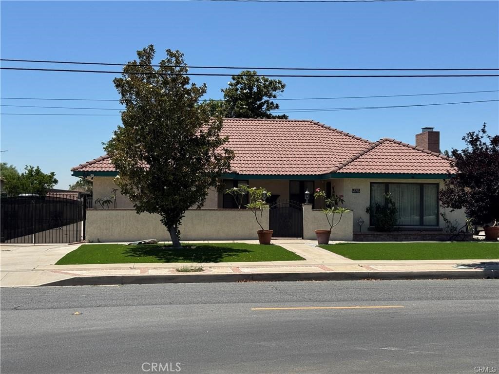 758 South Acacia Avenue Rialto, CA 92376 - Photo 1 of 1 a front view of house with yard