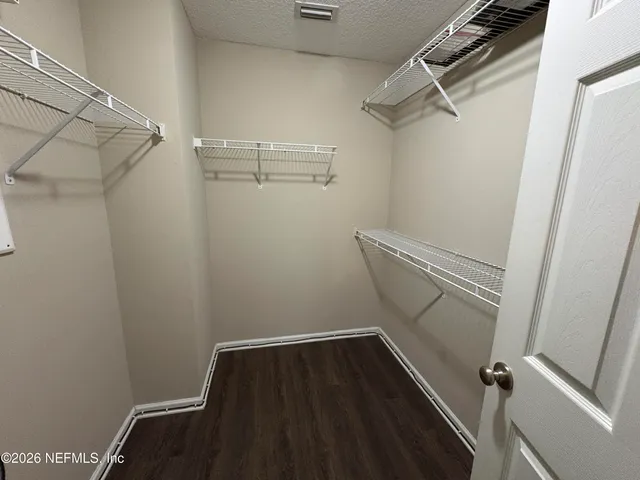 a view of a room with racks on the wall