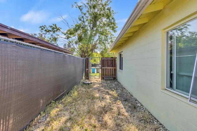 a backyard of a house with lots of green space