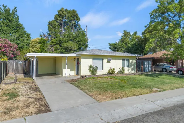 front view of a house with a yard