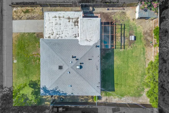 an aerial view of residential houses with outdoor space
