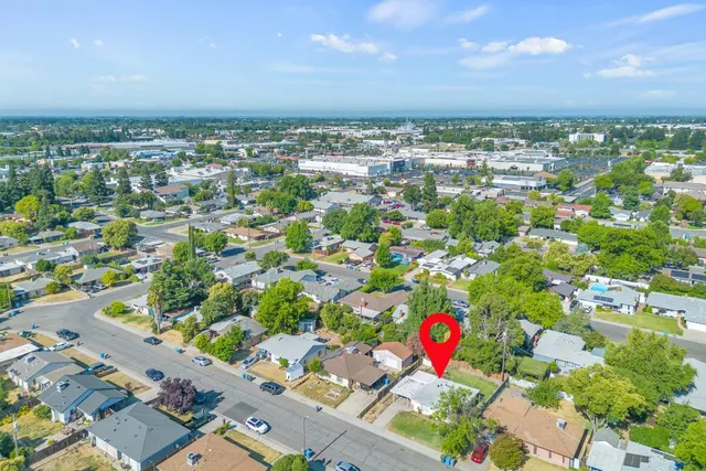 an aerial view of residential houses with outdoor space