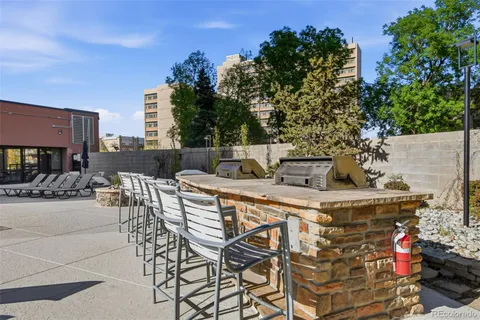 a view of a patio with couches and a table and chairs