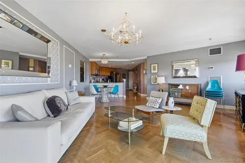 a view of a livingroom with furniture and a flat screen tv