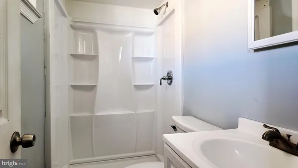a bathroom with a sink and toilet