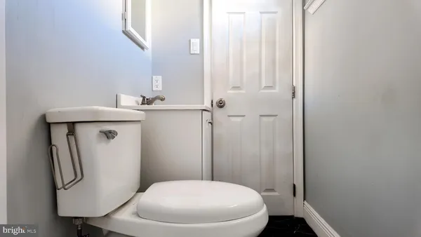 a bathroom with a toilet and a sink
