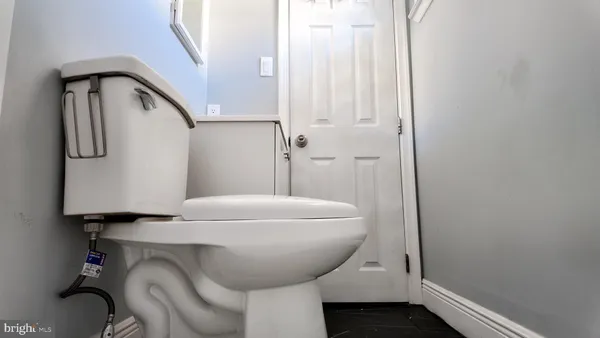 a bathroom with a toilet and a sink