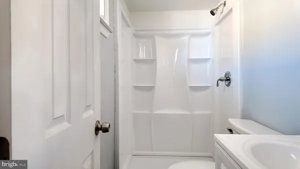 a bathroom with a tub and sink