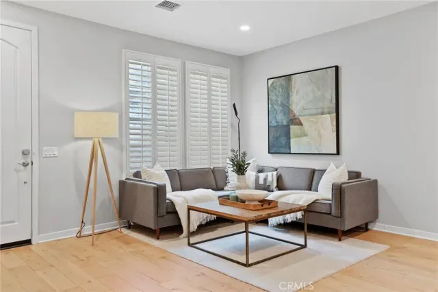 a living room with furniture and a window