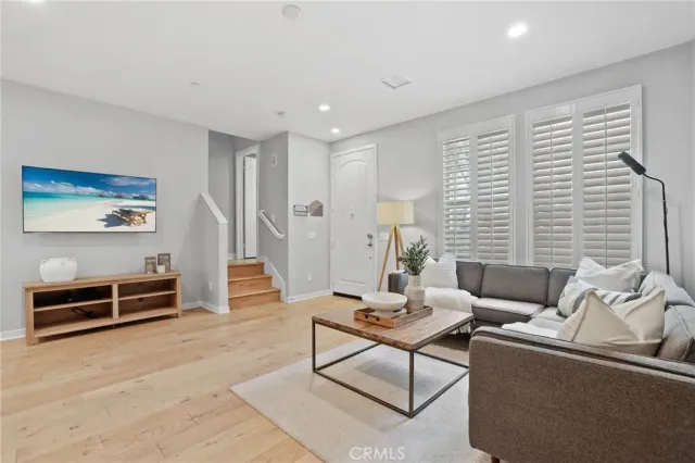 a kitchen with kitchen island granite countertop stainless steel appliances cabinets a sink and a center island