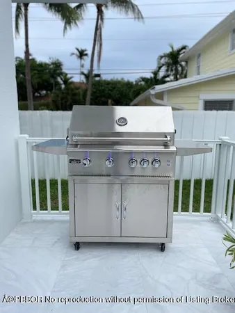 a view of a patio with a table and chairs