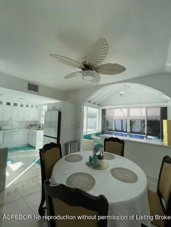 a dining room with a table and chairs