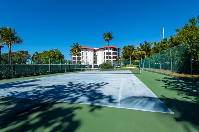 a kitchen with a sink cabinets and window