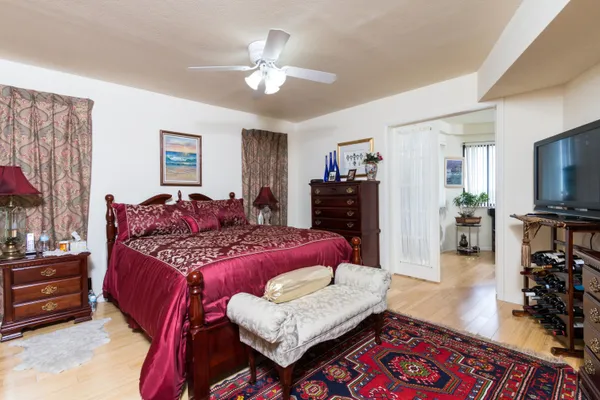 a front view of building with lot of trees