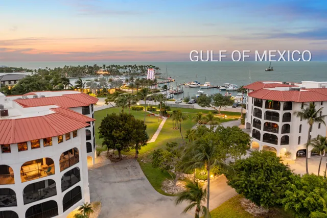 an aerial view of a house with a ocean view