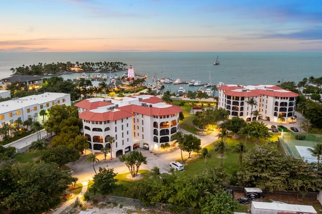 an aerial view of a house with a ocean view