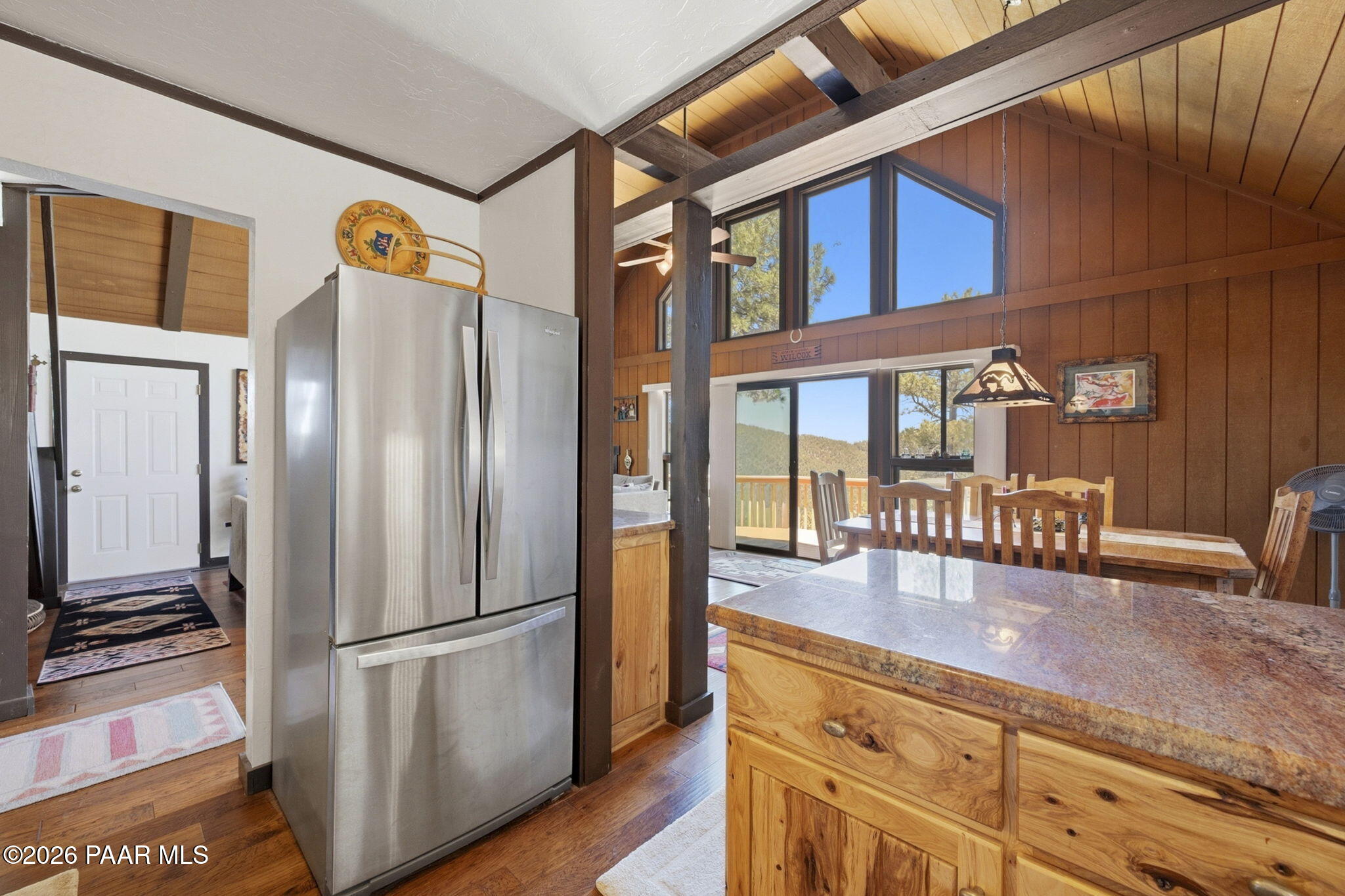 7251 South Big Bug Mesa Road Mayer, AZ 86333 - Photo 20 of 55 a kitchen with stainless steel appliances granite countertop a refrigerator a stove and a sink with wooden floor
